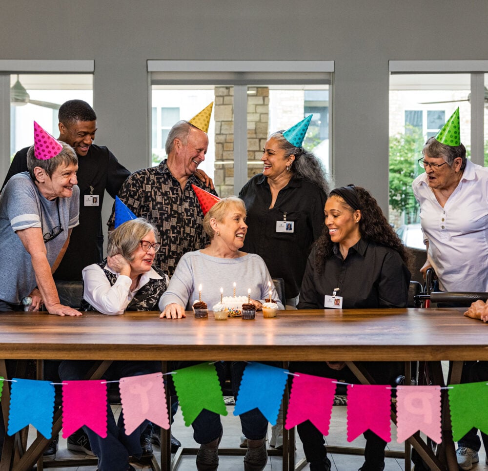 Seniors celebrating a birthday at a community
