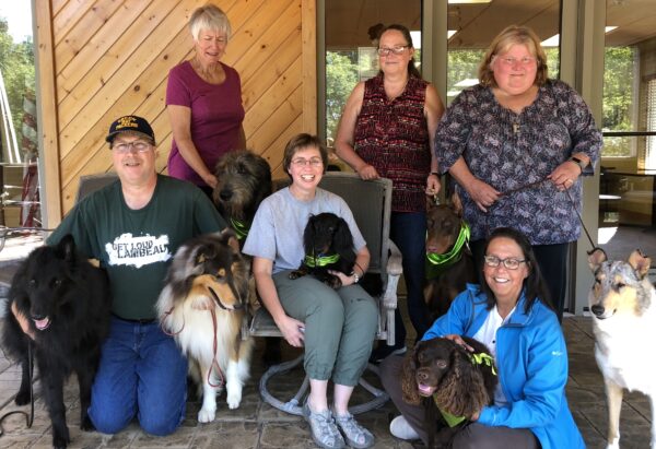 Group of seniors gather with dogs at a senior living community in Green Bay, Wisconsin.
