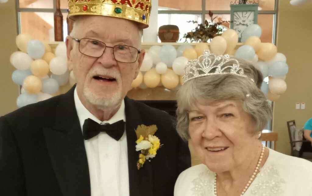 Senior man and woman are crowned king and queen at their senior living community in Green Bay, Wisconsin.