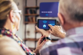 Two seniors learn how to use their smart home devices.