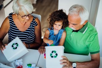 Grandparents how granddaughter how to recycle.