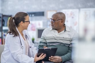 Doctor discussing medical issues with senior patient