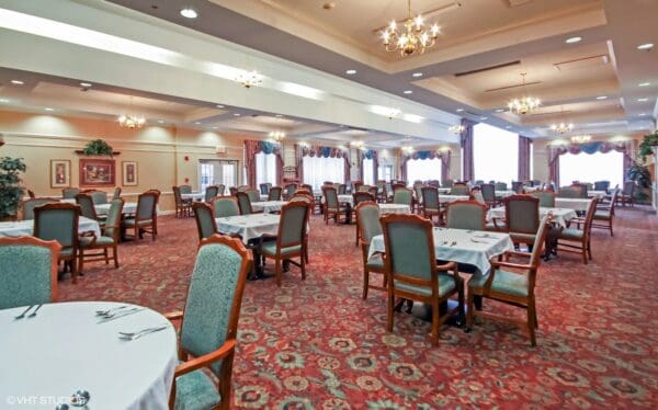 Dining room with ample seating and natural light at a senior living community in Fairfield, Ohio.