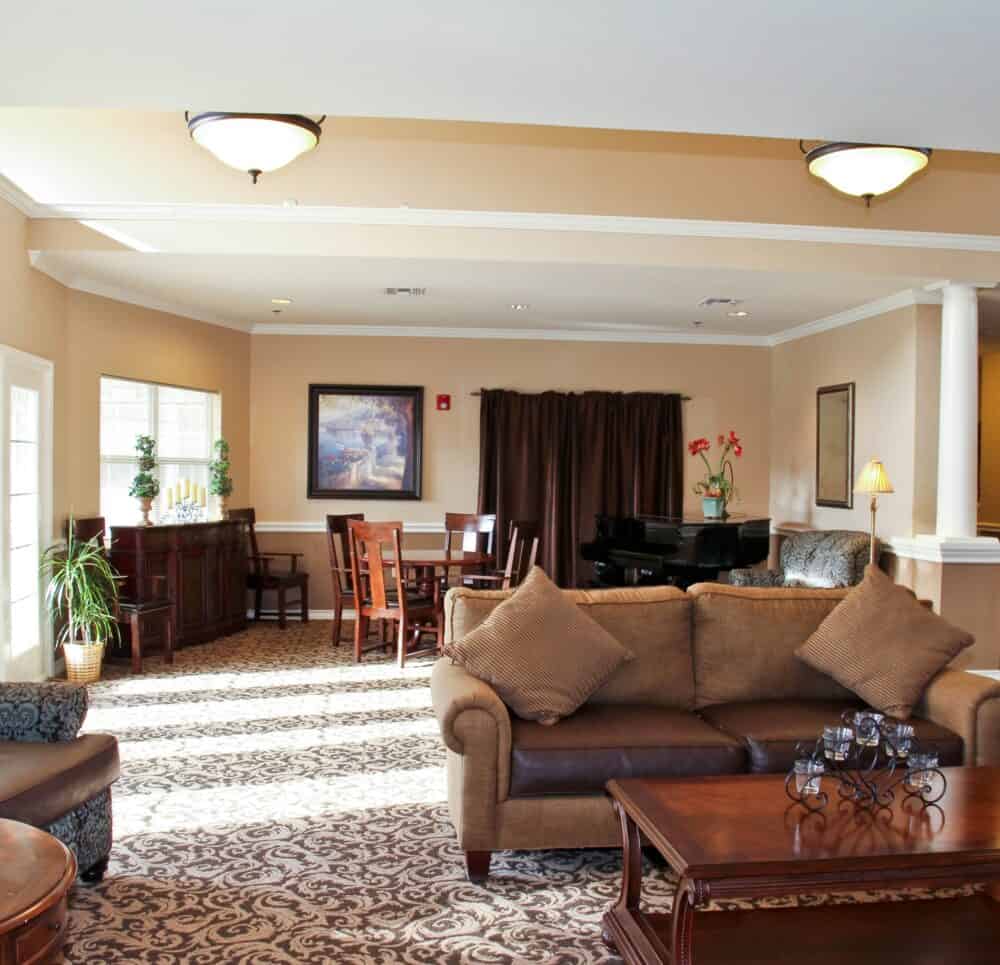 Lounge area with a piano inside Good Tree, a senior living community in Stephenville, Texas.
