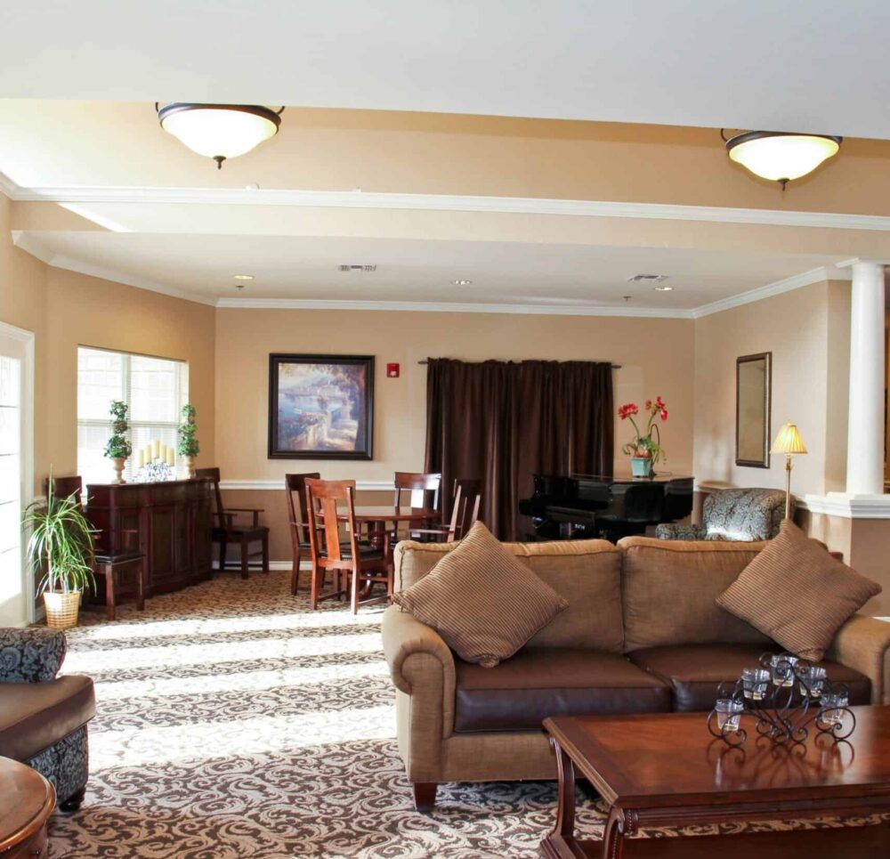 Lounge area with a piano inside Good Tree, a senior living community in Stephenville, Texas.