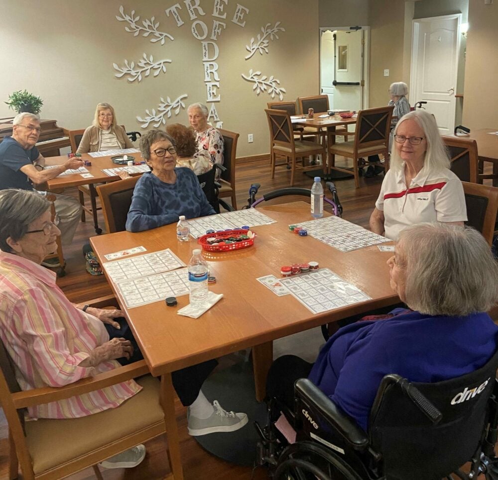 Group of senior women play bingo together at a senior living community in Arlington, Texas.