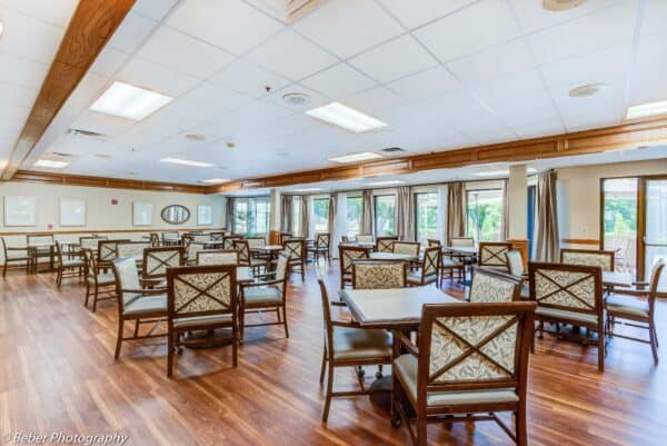 Senior living dining room with comfortable seating and natural light in Hot Springs, Arkansas.