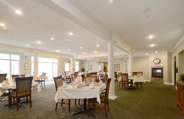 Dining room with comfortable seating and ample natural light at a senior living community in Indianapolis, Indiana.