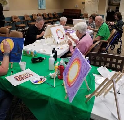 Seniors engaged in a painting class in Mansfield, Ohio.