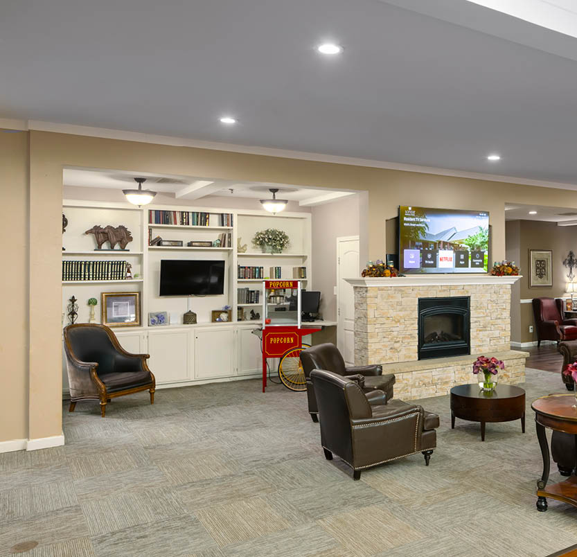 The Waterford on Cooper activity room with fireplace and games