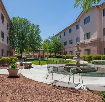 A beautiful courtyard with landscaping, seating and a fountain in Cottonwood, Arizona.