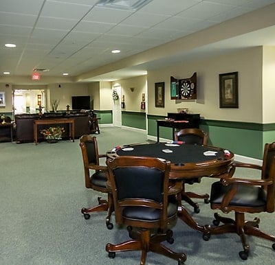 A large room with poker tables and lounge seating in Hamilton, Ohio.