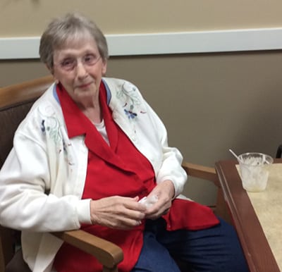 A senior enjoying her cooking class treat in Anderson, Indiana.