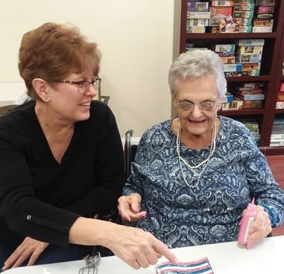 A senior woman and caregiver doing a craft together in Perrysburg, Ohio.