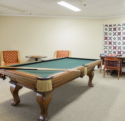A billiards table in a spacious activity center in Mesquite, Texas.