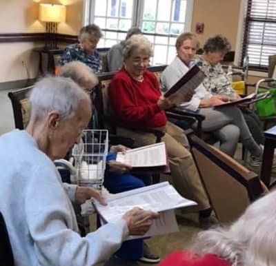 Seniors taking part in a singalong at their independent living/memory care community in Anderson, South Carolina.