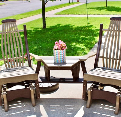 Two rocking chairs and an end table on a patio in Park Falls, Wisconsin.