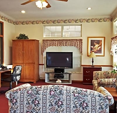 A big-screen TV in a comfortable lounge area in Jeffersonville, Indiana.