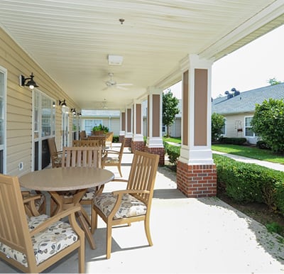 Covered patio with comfortable seating and overhead fans in Indianapolis, Indiana.