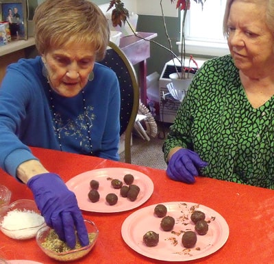 Senior women participating in a baking activity in Anderson, South Carolina.