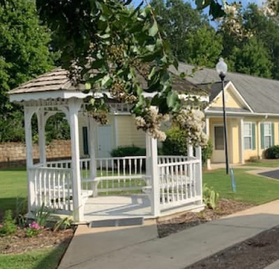 A white gazebo with walking path and beautiful landscaping in Anderson, South Carolina.