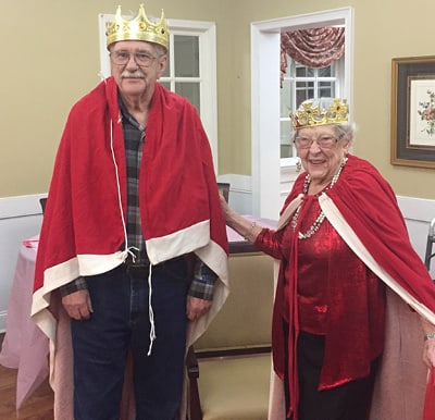 A couple dressed as royalty and celebrating an anniversary in Anderson, South Carolina.