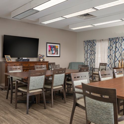 Cozy sitting area with a television at a senior living community in San Antonio, Texas