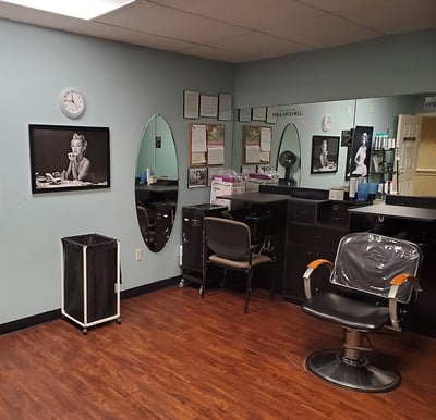 Beauty salon with multiple stations and images of movie stars on the walls on Columbiana, Ohio.