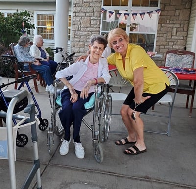 Residents and team members smiling and enjoying time on the patio on a nice day in Columbiana, Ohio.