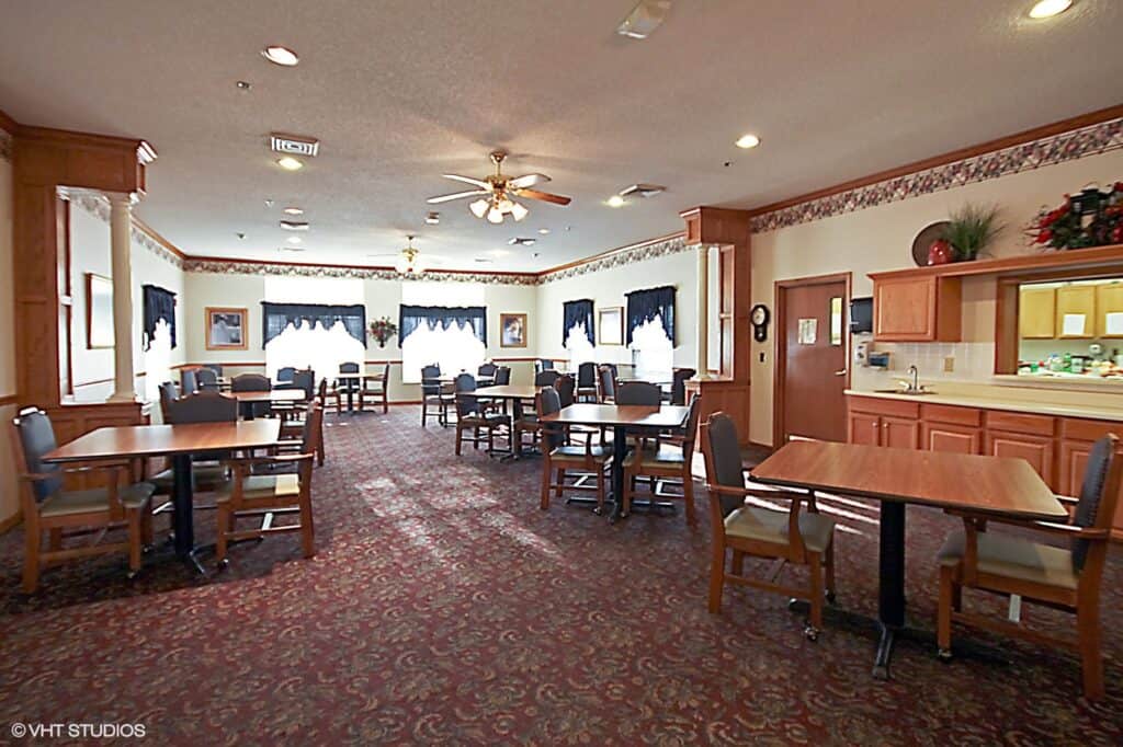 Riverbend senior living dining room with comfortable seating in Jeffersonville, Indiana.