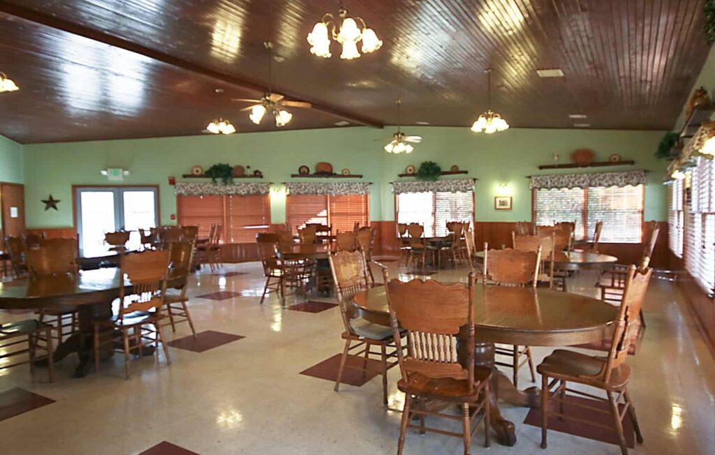 Large dining room with many chairs and tables at a senior living community in Greenwood, Indiana.