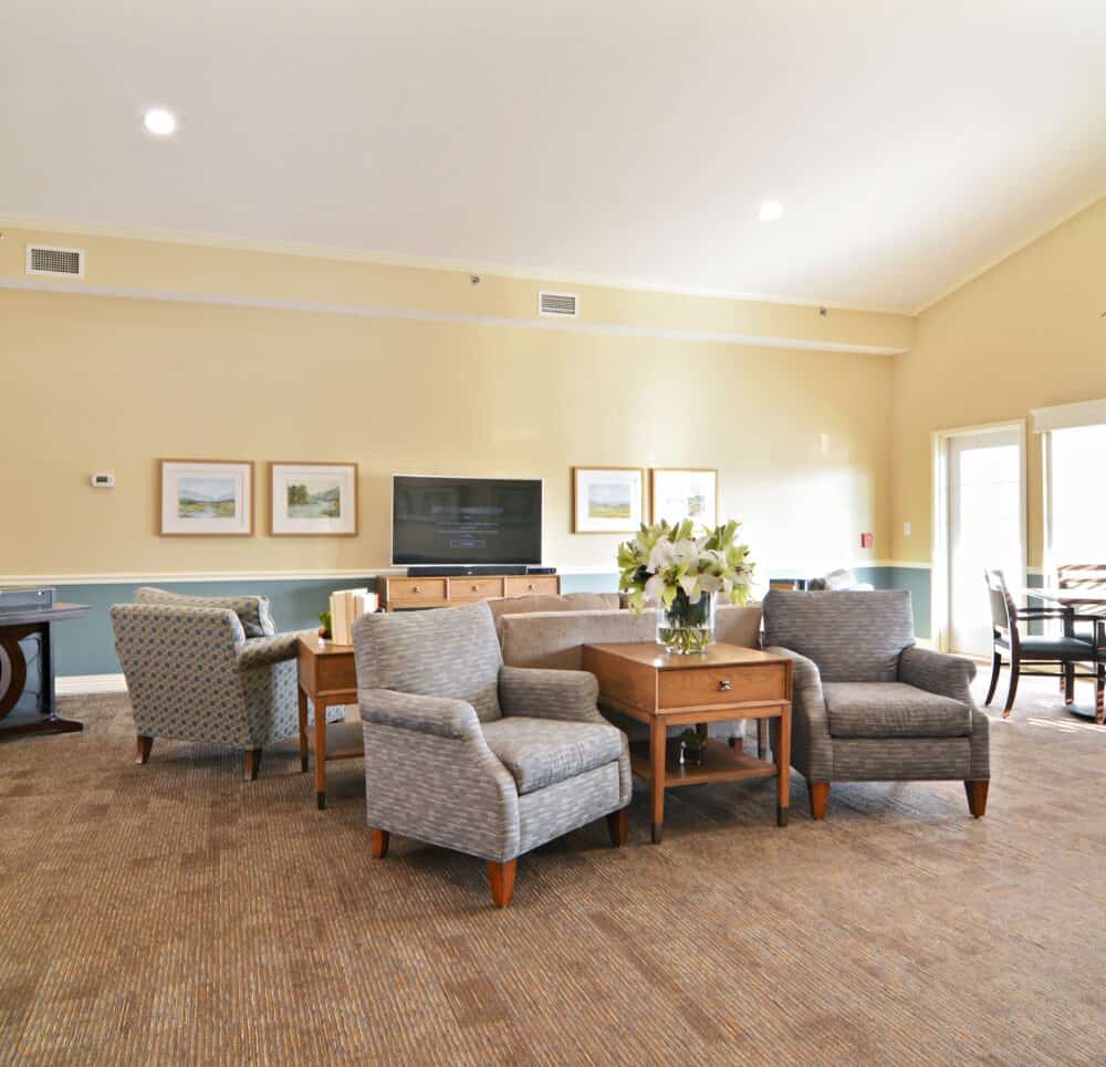 Large room with TV and couches at a senior living community in Chardon, Ohio.