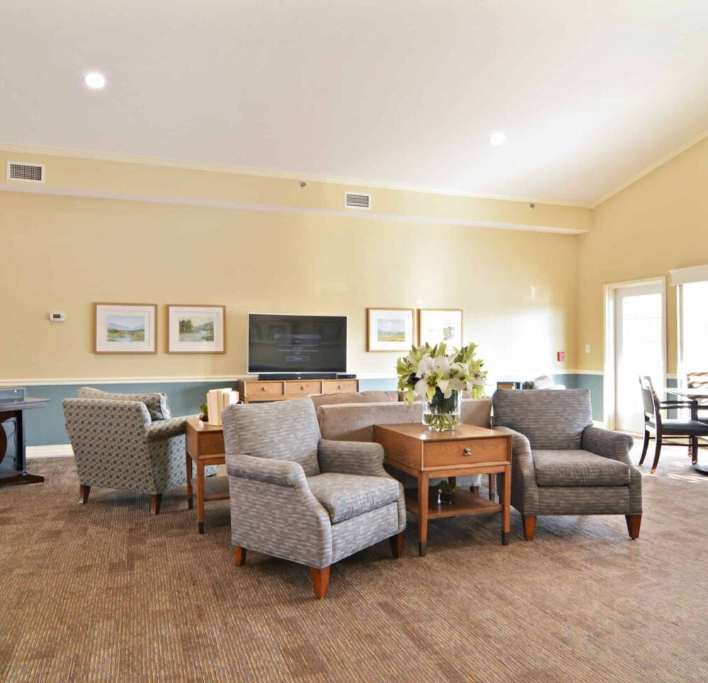 Large room with TV and couches at a senior living community in Chardon, Ohio.