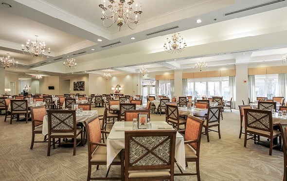 Large and elegant dining room with many tables and chairs and chandeliers in Ridgeland, Mississippi.