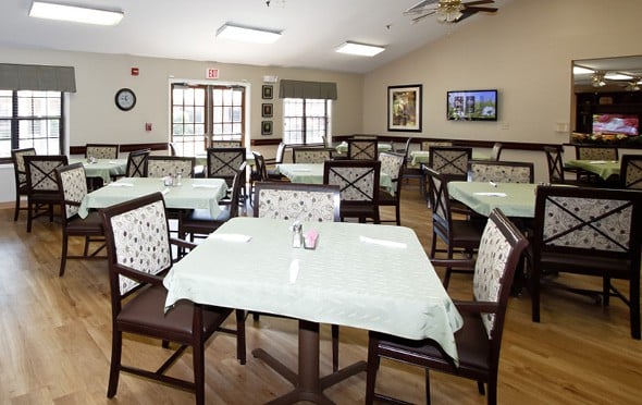 A large dining room with many tables in North Pointe, a senior living community in Anderson, South Carolina