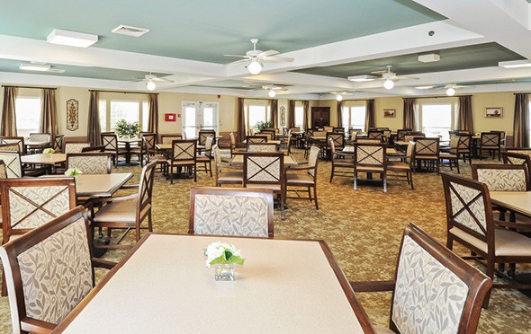 A large, modern dining room with a light blue ceiling in Indianapolis, Indiana