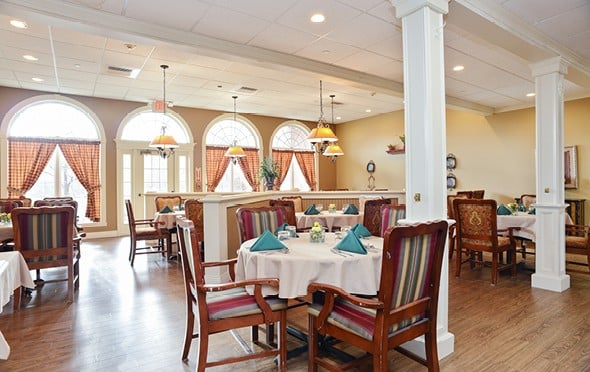 Beautiful, bright dining room with lots of seating and large windows in Springfield, Massachusetts.
