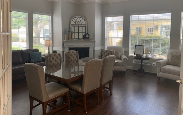 Beautiful private dining room with a fireplace and large windows in Anderson, South Carolina.