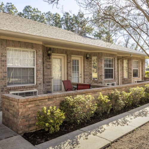 The Wellington at Conroe apartments lead to an outdoor courtyard