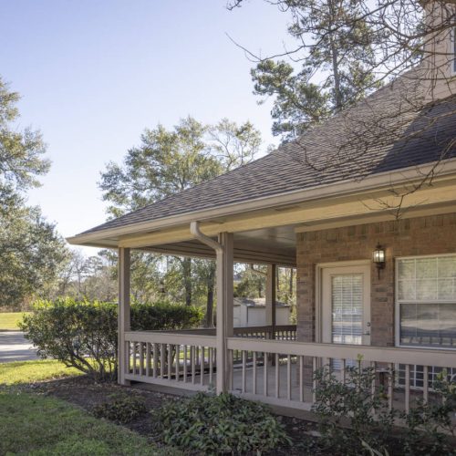 Outdoor patio with seating at The Wellington at Conroe