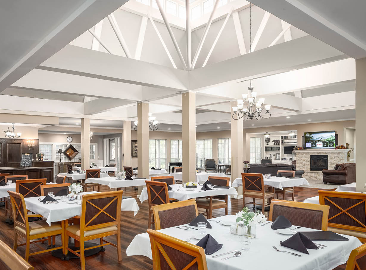 Senior living dining room with numerous tables and chairs in Arlington, Texas