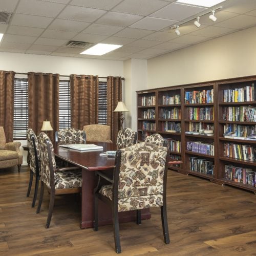 The Rosemont library has multiple shelves filled with books along with various seating options
