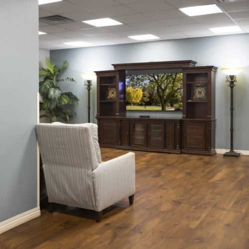 TV lounge includes comfortable seating options for seniors to watch a show together