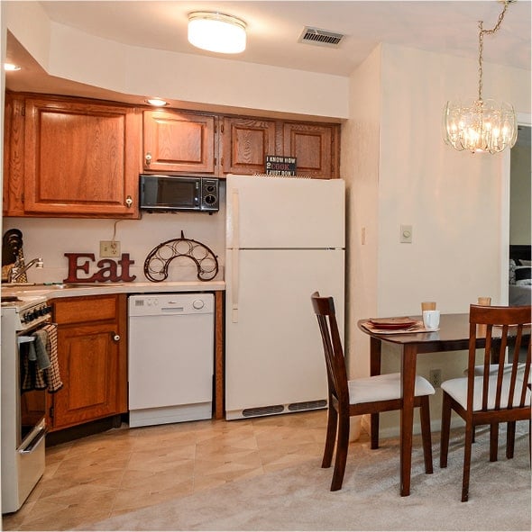 A kitchenette with dining area and chandelier in Fort Wayne, Indiana.
