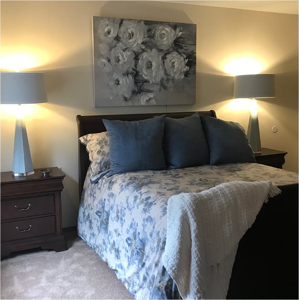 Model senior living apartment bedroom in Raleigh, North Carolina.