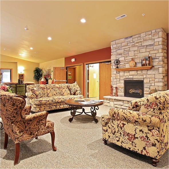 Beautiful lounge area with fireplace and comfortable, conversation furniture in Park Falls, Wisconsin.