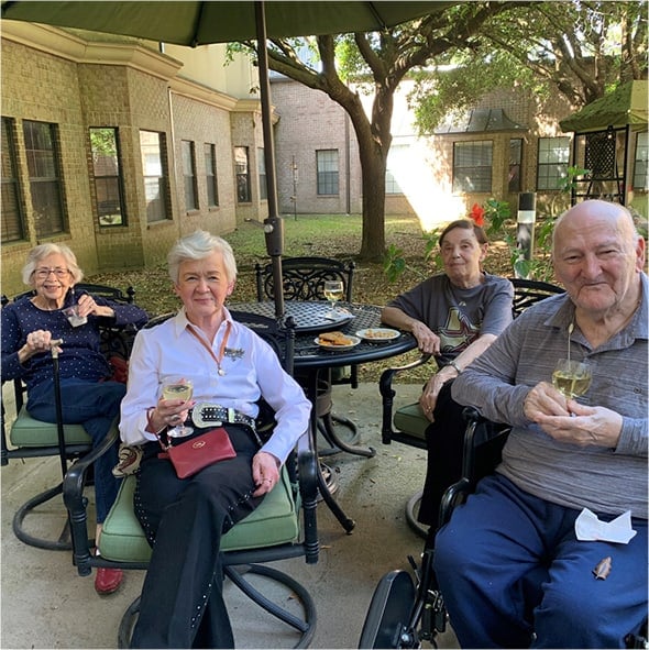 Friends enjoying happy hour outside in Humble, Texas.