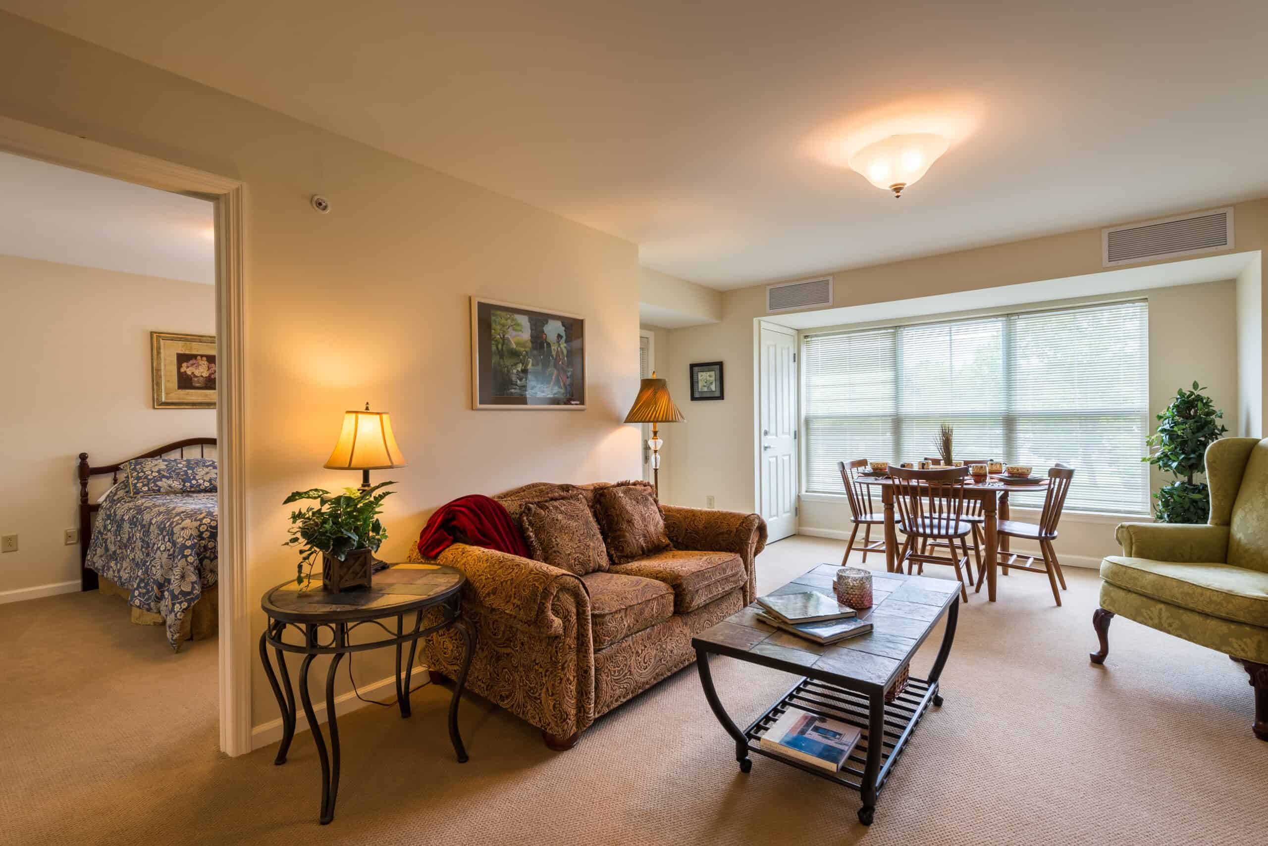 Model living room and bedroom at a senior living community in Oneonta, New York.