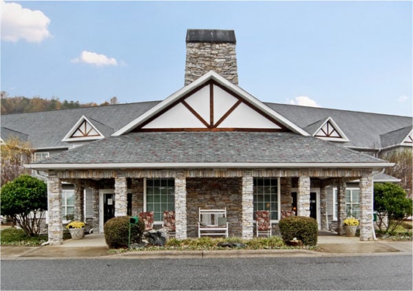 Entrance to senior living community in Columbus, North Carolina with Blue Ridge Mountains in background.