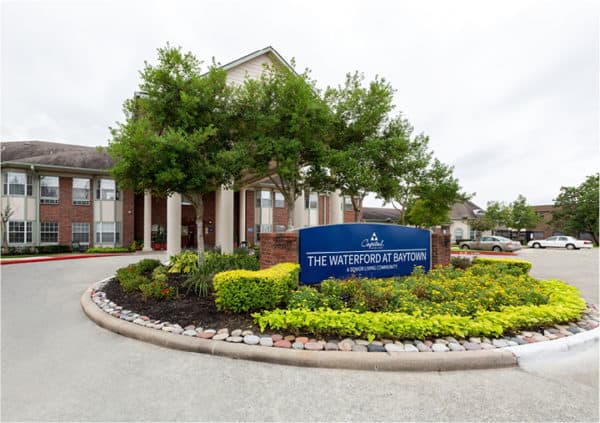 Senior living community in Baytown, Texas, with beautifully decorated grounds.